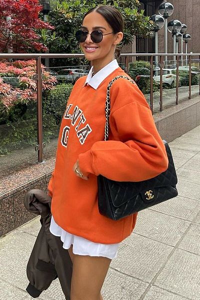 MODAGEN Orangefarbenes Atlanta-Sweatshirt mit Rundhalsausschnitt für Damen in Übergröße