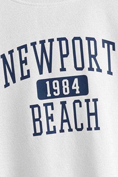 MODAGEN Tricou supradimensionat unisex, alb, Newport Beach 1984 cu imprimeu