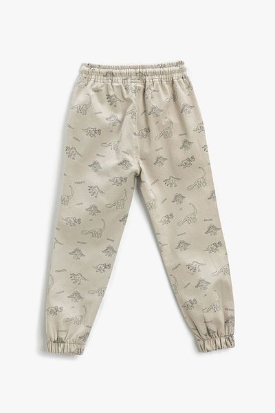 Koton Jungen-Jogginghose mit gebundener Taille und Tasche mit Dinosaurier-Muster 3skb40021tw