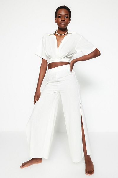 Trendyol Collection Ecru tkané plážové kalhoty ze 100% bavlny TBESS21PL0493