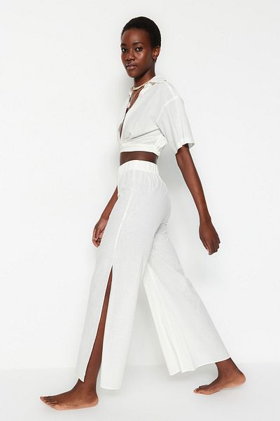 Trendyol Collection Ecru tkané plážové kalhoty ze 100% bavlny TBESS21PL0493
