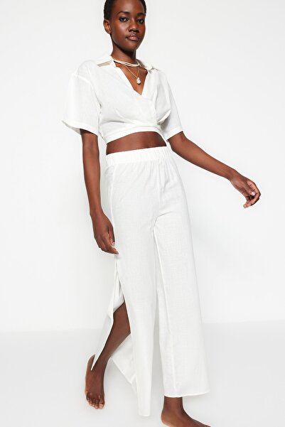 Trendyol Collection Ecru tkané plážové kalhoty ze 100% bavlny TBESS21PL0493