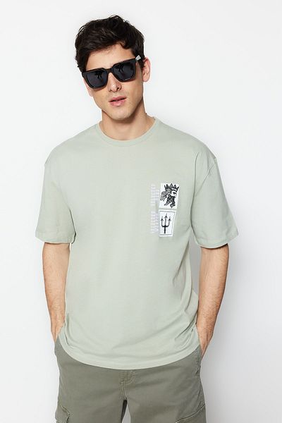 Trendyol Collection Umělecké bavlněné tričko Mint Oversize s potiskem - Krátký rukáv TMNSS21TS3559