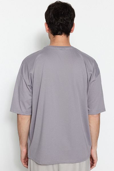 Trendyol Collection Šedé oversize tričko s krátkým rukávem s výstřihem – TMNSS22TS0317