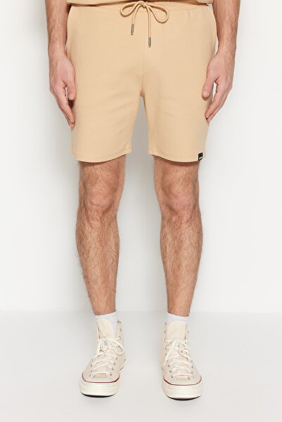 Trendyol Collection Béžové Regular Premium 100% bavlněné texturované šortky s detailem štítku - TMNSS23SR00032
