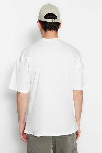 Trendyol Collection Бавовняна футболка великого розміру з коротким рукавом з принтом екрю TMNSS23TS00261