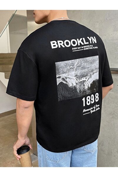 ORLONTEX تيشيرت كبير الحجم مطبوع بظهر بروكلين باللون الأسود للجنسين