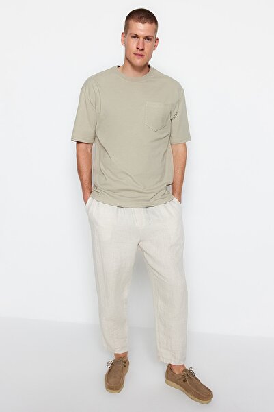 Kolekcia Trendyol Oversize bavlnené tričko s krátkym rukávom s textúrou a vreckami - TMNSS23TS00225