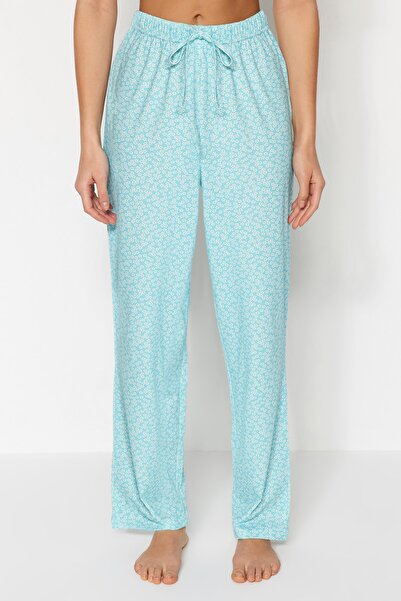 Trendyol Collection Světle modré květinové bavlněné pletené pyžamové kalhoty THMSS23PJ00005