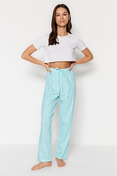 Trendyol Collection Světle modré květinové bavlněné pletené pyžamové kalhoty THMSS23PJ00005
