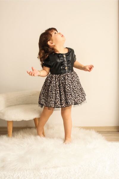 tunay moda فستان من التول والجلد بتفاصيل جلد الفهد