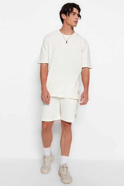 Trendyol Collection Lässiges, strukturiertes Baumwoll-Stein-Trainingsanzug-Set mit Textdruck – TMNSS23EM00006
