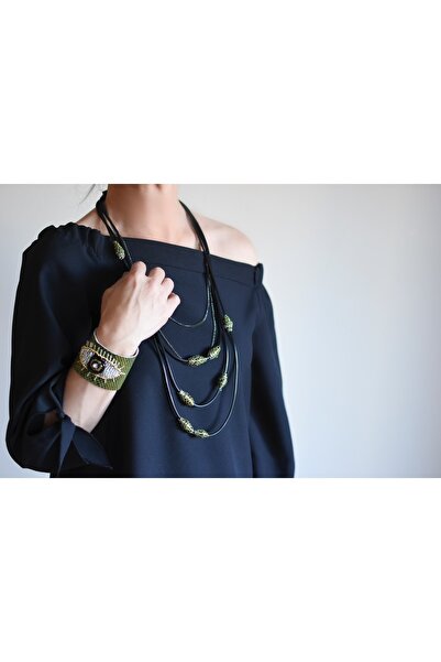 AGG TASARIM سوار جلدي بتصميم عين خضراء