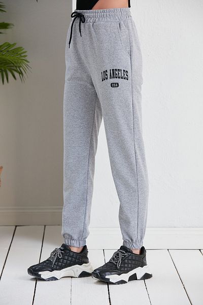Green Hill Summer sweatpants with LOS ANGELES written on them