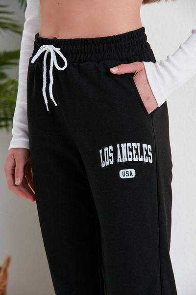 Green Hill Summer sweatpants with LOS ANGELES written on them