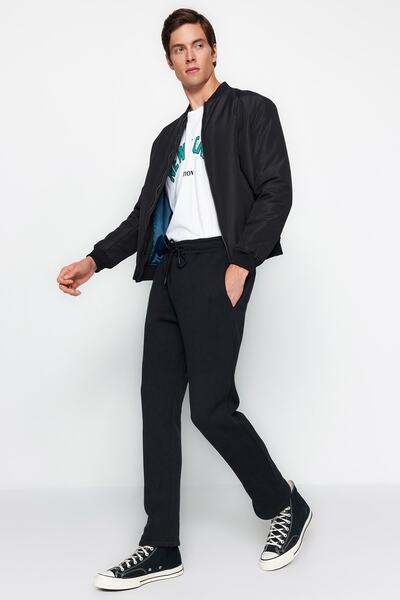 Trendyol Collection Μαύρο βαμβακερό παντελόνι με ανοιχτό πόδι - κανονική εφαρμογή TMNAW24EA00011