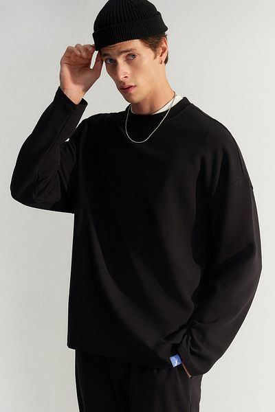 Trendyol Collection Μαύρο φούτερ με υφή Oversize - Λεπτομερής ετικέτα, περιορισμένη έκδοση TMNAW24SW00073