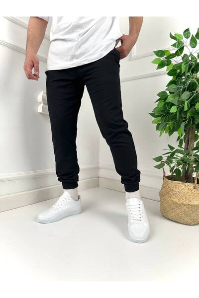 tetramoda بنطال رياضي مضلع أسود بقصة ضيقة