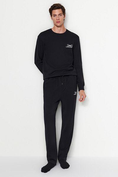 Trendyol Collection Μαύρο κανονικό/κανονικό κομμένο φουσκωτό τύπωμα εσωτερικά φλις/ζεστό παντελόνι φούτερ με ανοιχτό πόδι TMNAW24EA00012