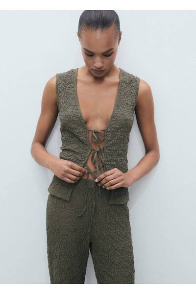 Textured blouse with tie detail