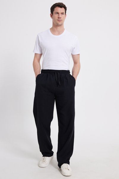 Men's baggy fit wide cut 100% cotton elastic waist side pocketed muslin black plain trousers