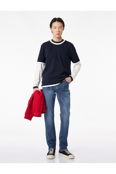 Фармерки со нормален струк, џебови и памучен Slim Fit крој - Brad Jean