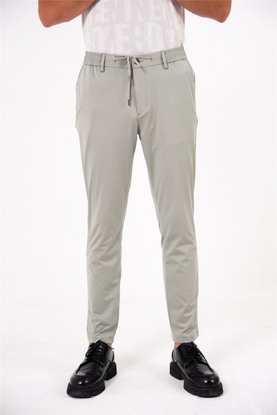 Men's jogger pants with elastic waistband, back pockets, and snap closure.