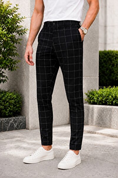Машки црни панталони slim fit од кариран материјал со ликра