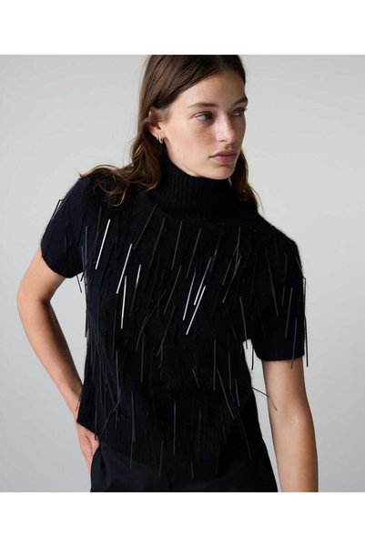 Tasseled turtleneck sweater