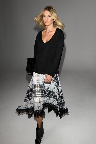 Avalyn women's plaid patterned skirt with lace trim, asymmetrical hem, and mesh pattern.