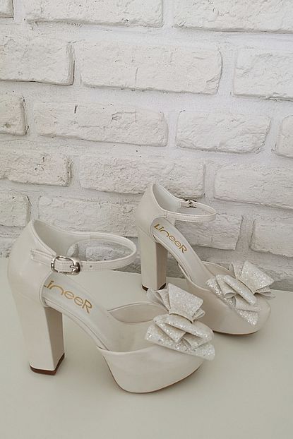https www trendyol com lineer kadin sedef beyaz renk fiyonklu 12 cm palatform topuklu abiye gelin ayakkabisi p 37748791