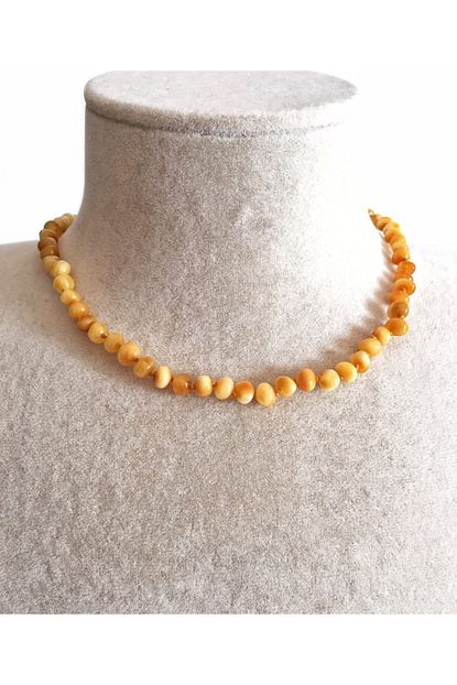 ipek kehribar unisex bebek sari baltik dis kolyesi sut beyaz kehribar kolye fiyati yorumlari trendyol
