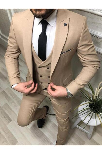 beige vest and tie