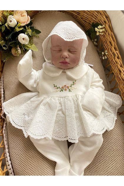 Hand-embroidered detailed baby girl hospital exit set with booties, ruffled bottoms, ruffled top, and hat.