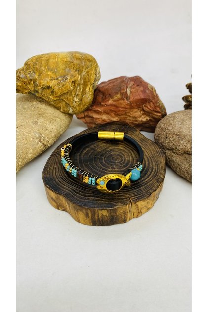 Handmade leather bracelet with braided beads, brass fish apparatus and magnet clip