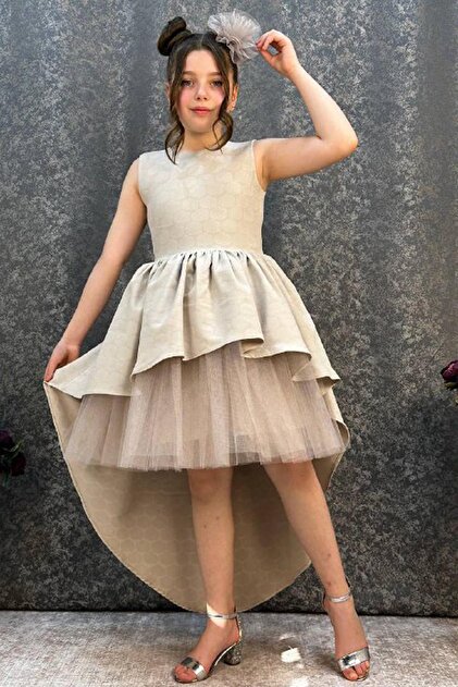 Riccotarz Girl's Cream Evening Dress with Short Tulle Detail on the Front and Long Ribbon Detail on the Back, Age 6-9- Trendyol Riccotarz Girl's Cream Evening Dress with Short Tulle Detail on the Front and Long Ribbon Detail on the Back, Age 6-9- Trendyol