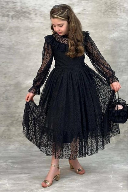 Girl's black dress with sheer tulle and ruffle details on sleeve and collar