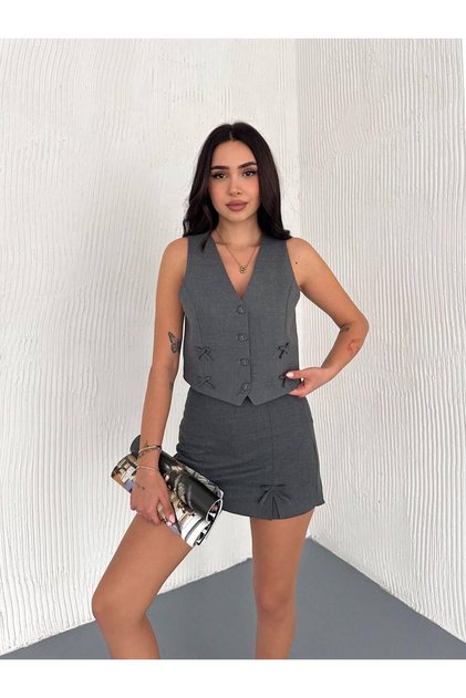 Two-Piece Suit with Bow Detail Vest and Shorts Skirt