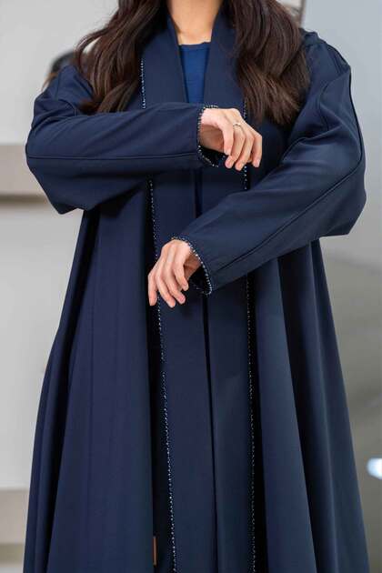 Navy blue cloche abaya with beaded inserts on the front and arms