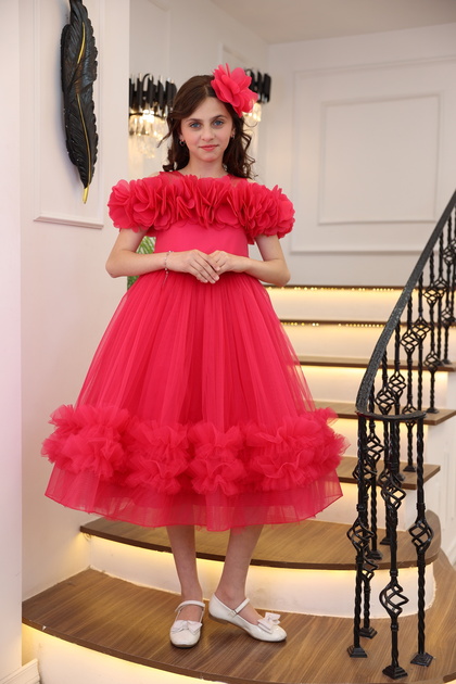 Long girl's evening dress with layered sleeves, floral print, off-the-shoulder, stone details, and ruffled skirt