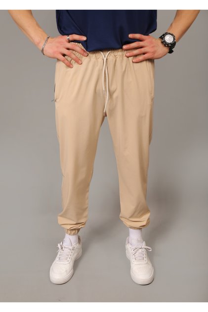 Men's Beige Parachute Fabric Regular Fit Elastic Leg Pocket Zippered Sweatpants