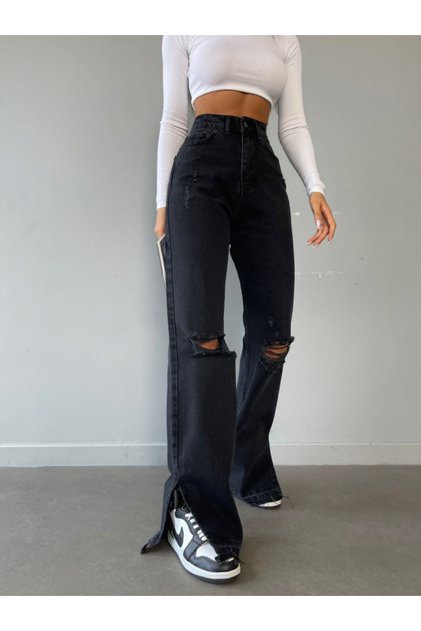 Flared jeans with rips and raw hem