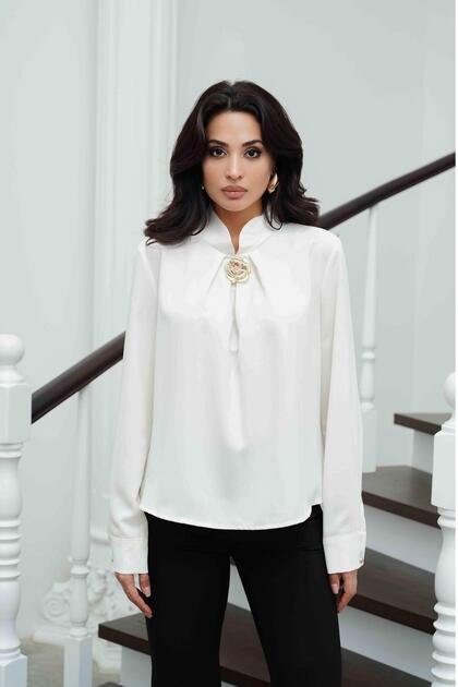 White satin blouse with high neck and buckle detail