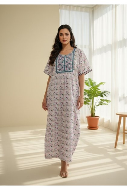 White floral jalabiya withpink embroidery on the yoke—light, breezy, and perfect for everyday wear.