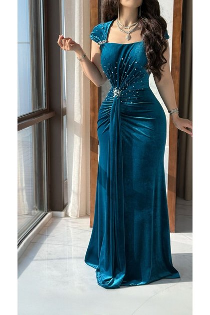 Turquoise velvet evening dress embellished with crystals