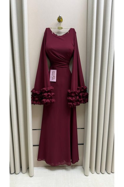 Elegant long evening dress in a burgundy color