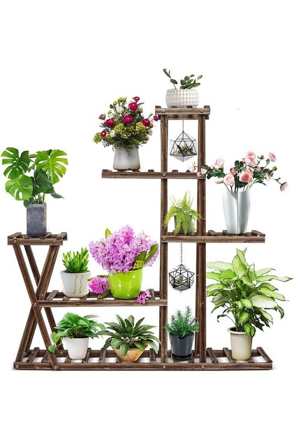 A wooden plant stand for indoor and outdoor plants.