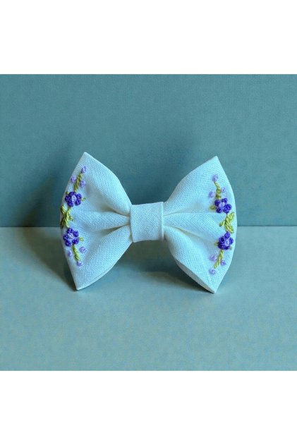 Elegant Hairless Doll with Purple Embroidery Barrette