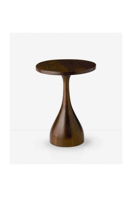 A luxurious, sculpted wooden side table