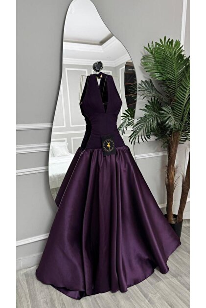 Dark purple evening dress with a halter neckline and a full satin skirt - a princess look